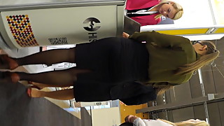 Candid expo girls in a office look black pantyhose and heels