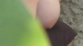 Natural young busty wife flashing in garden