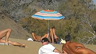 Slutwife masturbating for pervs in a beach